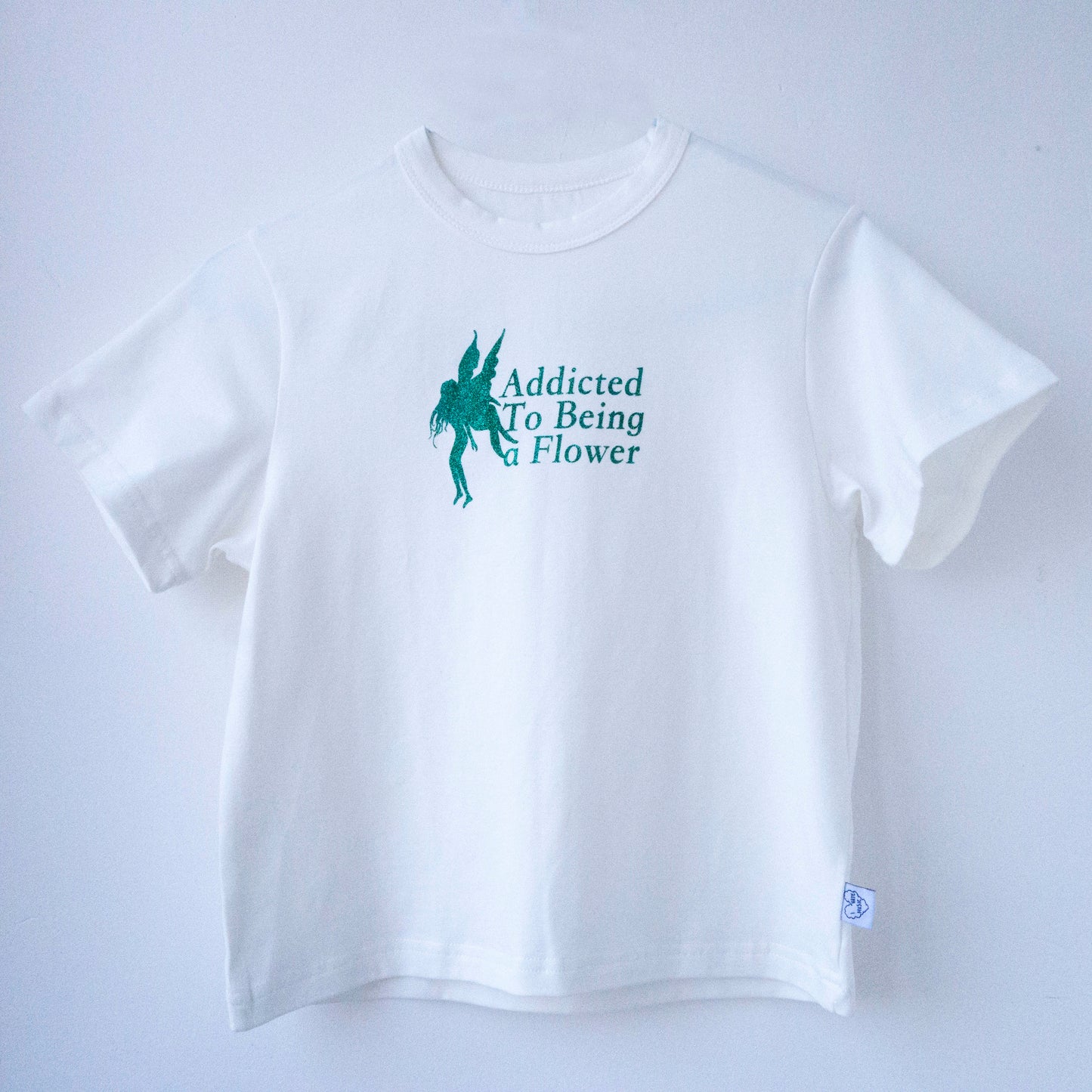 'Addicted to being a flower' baby tee