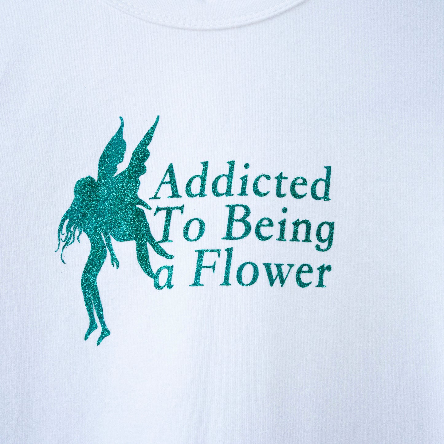 'Addicted to being a flower' baby tee