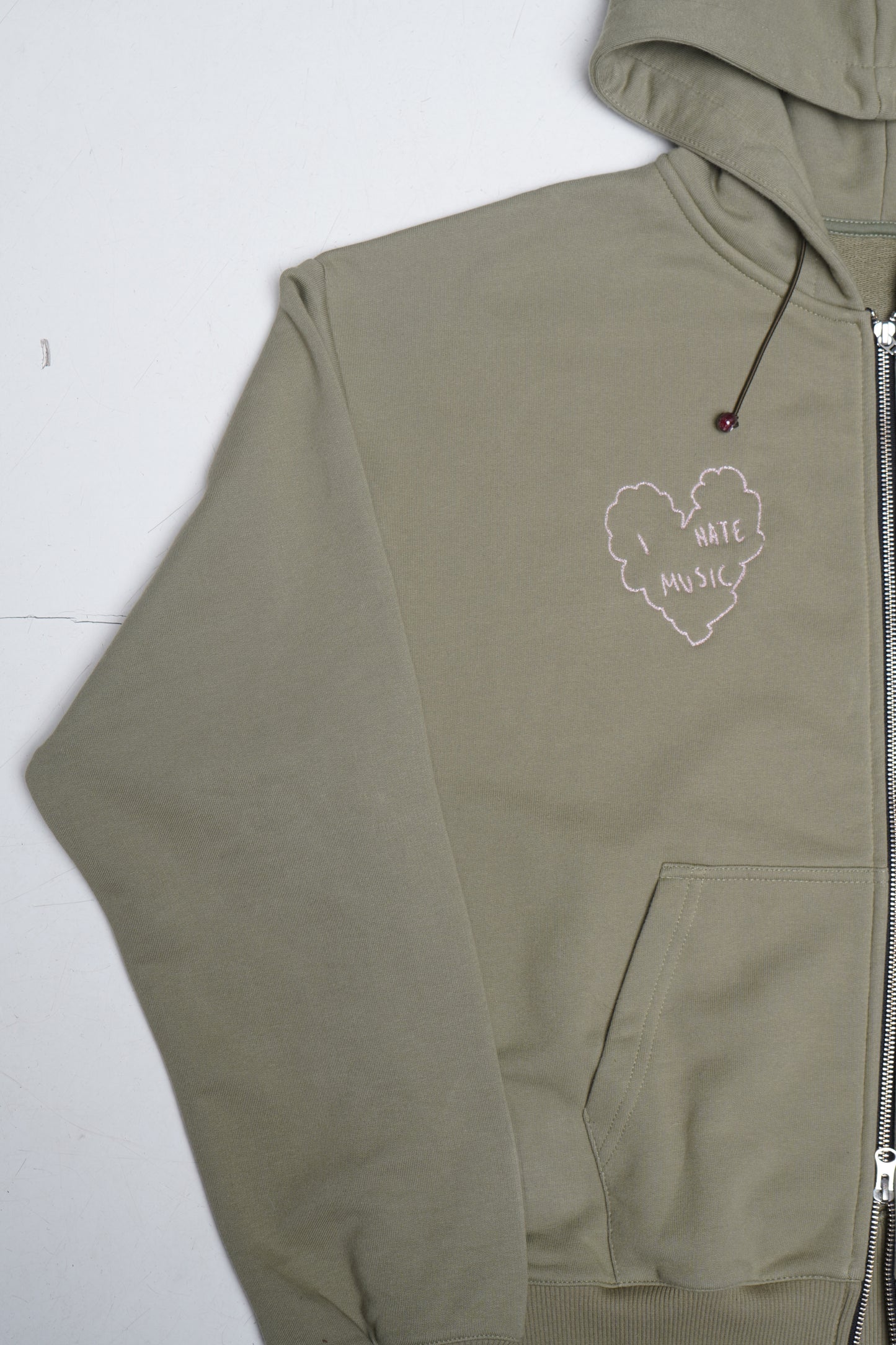 'i hate music' zip hoodie in green