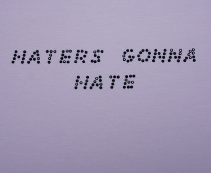 Text made of rhinestones 'HATERS GONNA HATE' on a plain background