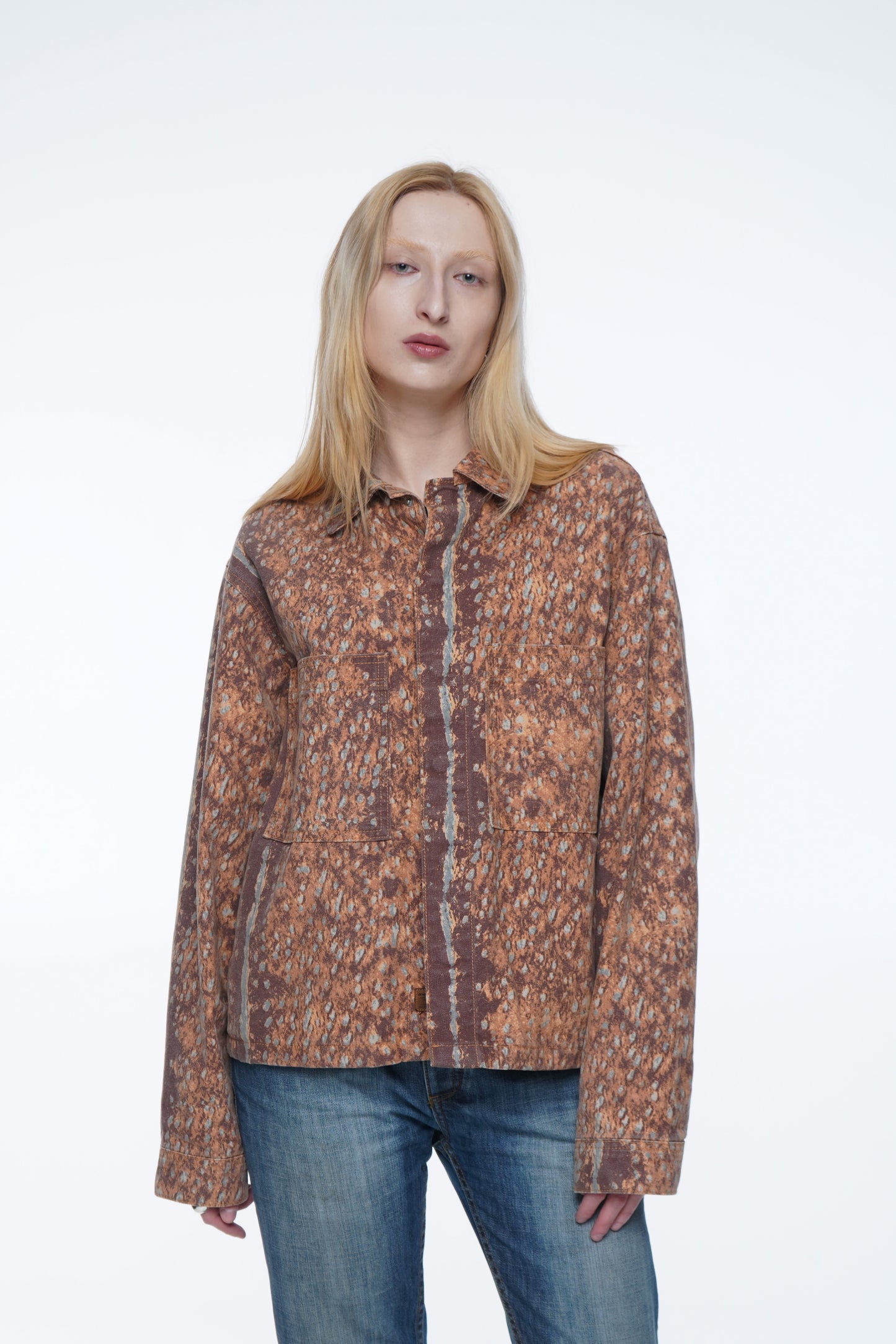 Woman wearing a Vintage reworked unisex jacket with embroidered cowboy artwork and relaxed fit.