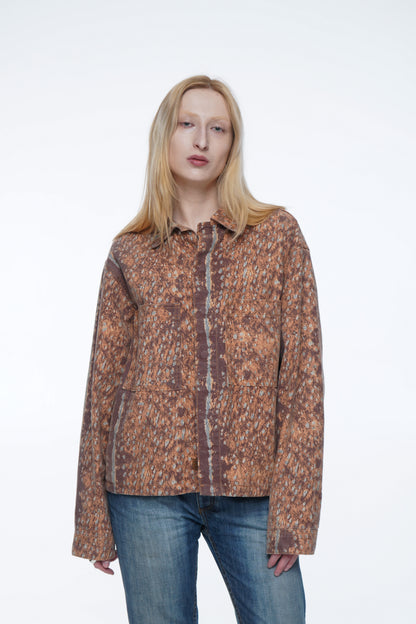 Woman wearing a Vintage reworked unisex jacket with embroidered cowboy artwork and relaxed fit.