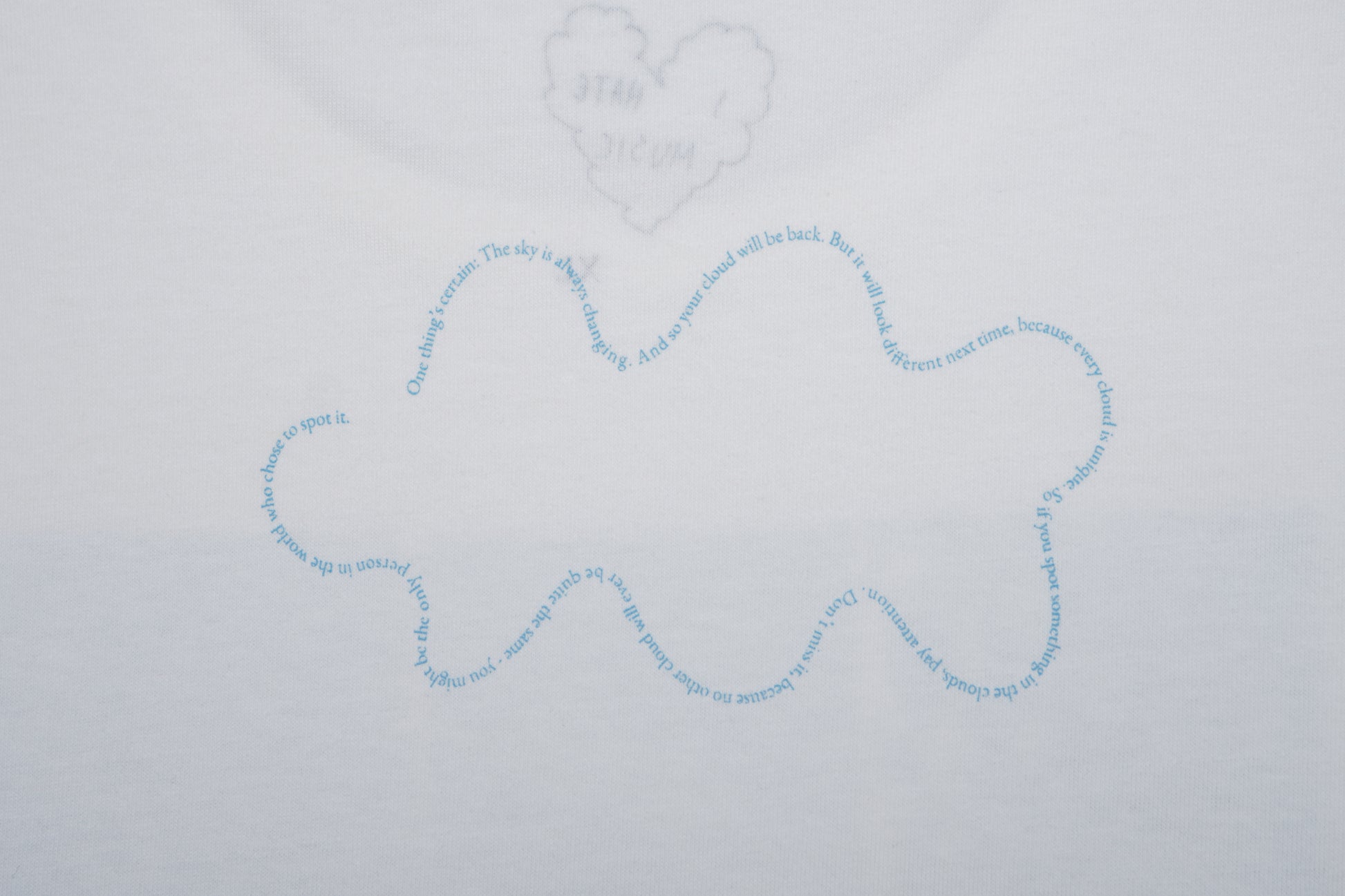 Blue cloud-shaped drawing on a light gray background