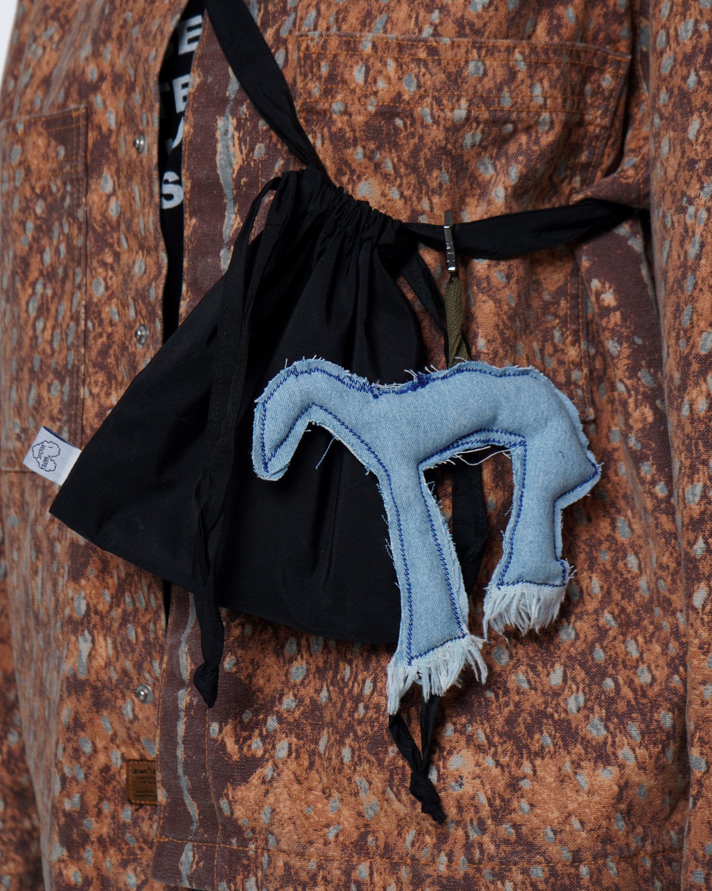 Compact lined mini bag made from durable raincoat fabric with a blue horse 