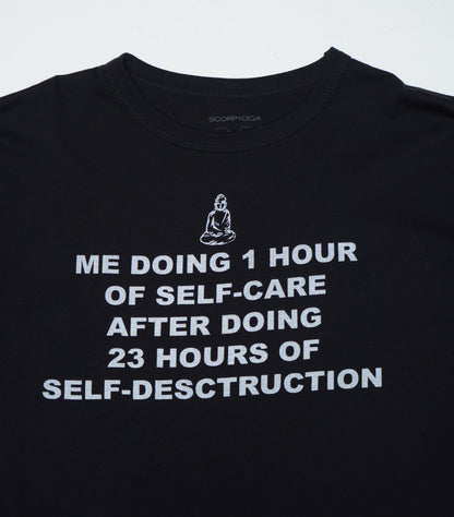 Black t-shirt with white text and a Buddha illustration on a light gray background