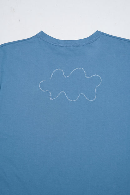 Blue t-shirt with a white cloud design on a light gray background