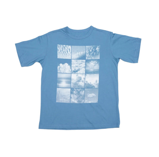 A blue t-shirt with a central graphic of a grid of white cloud images against a blue background.