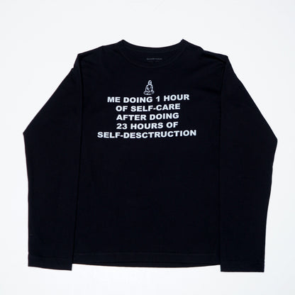 Graphic unisex long sleeve made in collaboration with Scorpyoga, featuring silkscreen text "me doing 1h of selfcare after doing 23h of self-destruction".