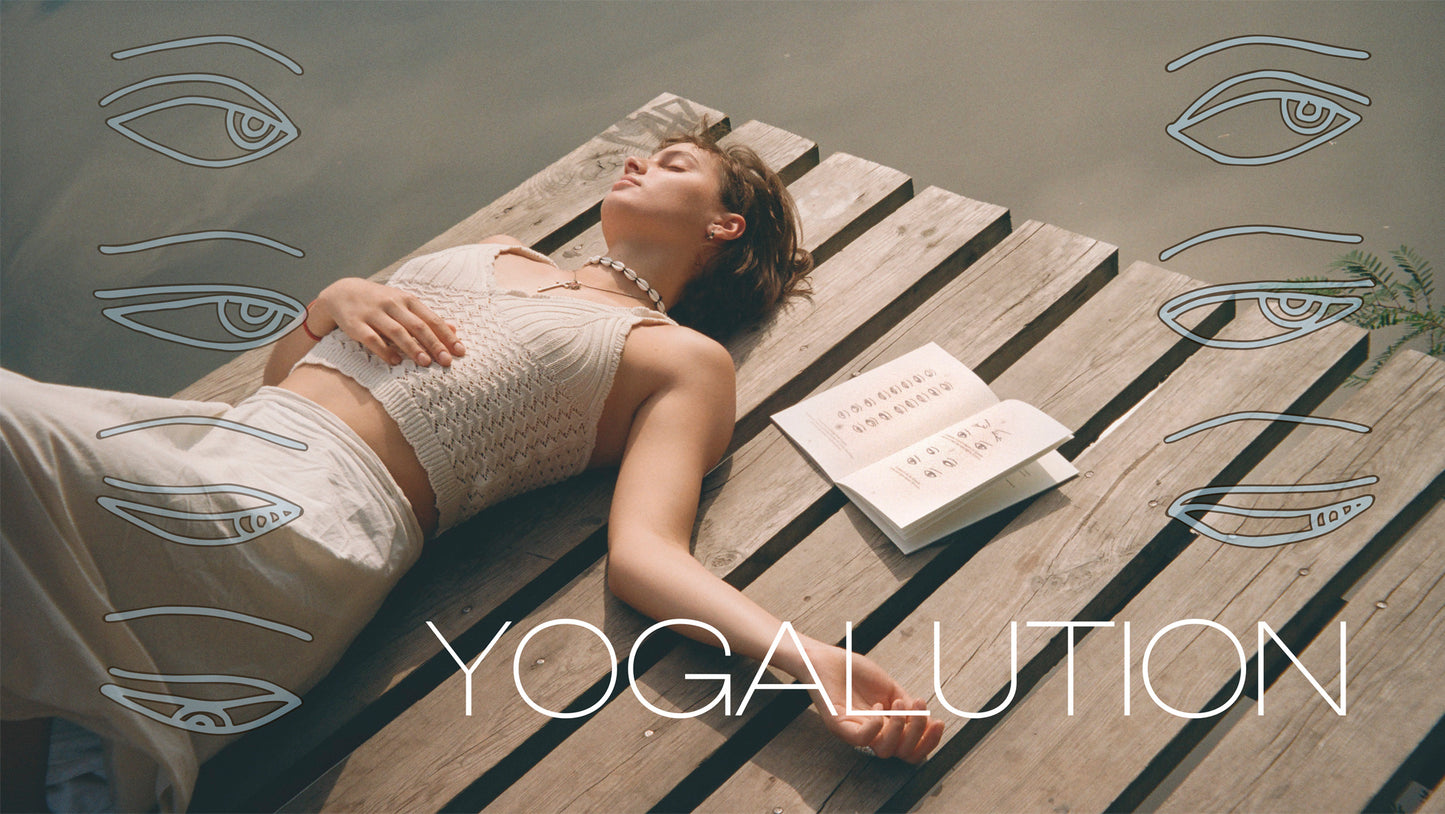 Woman relaxing on wooden platform with Yogalution visual yoga book, calm lifestyle scene with minimal aesthetic and symbolic eye illustrations, representing mindfulness and creative practice